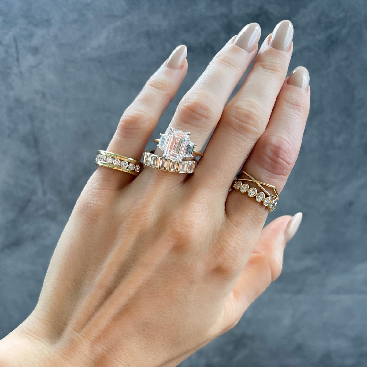 Three Stone ring with Trapezoid side diamonds and an Emerald cut - GOODSTONE