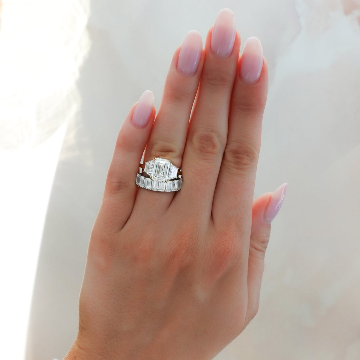 Three Stone ring with Trapezoid side diamonds and an Emerald cut - GOODSTONE