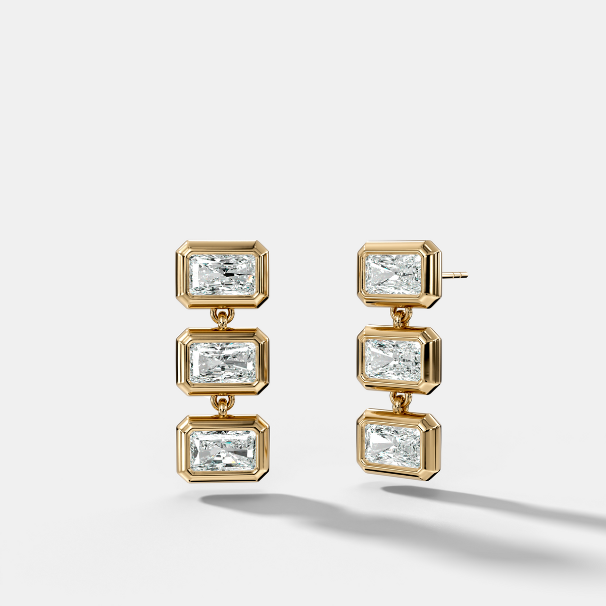 Three Stone Bezel Drop Earrings with East West Elongated Radiant Cut Diamonds