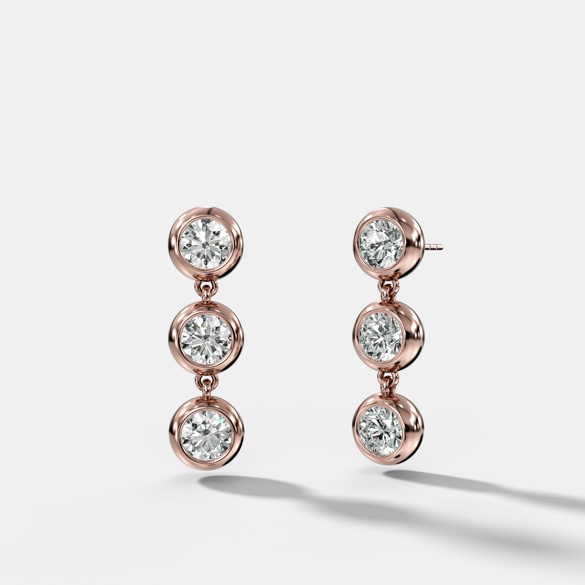 Three Stone Bezel Drop Earrings with Round Cut Diamonds