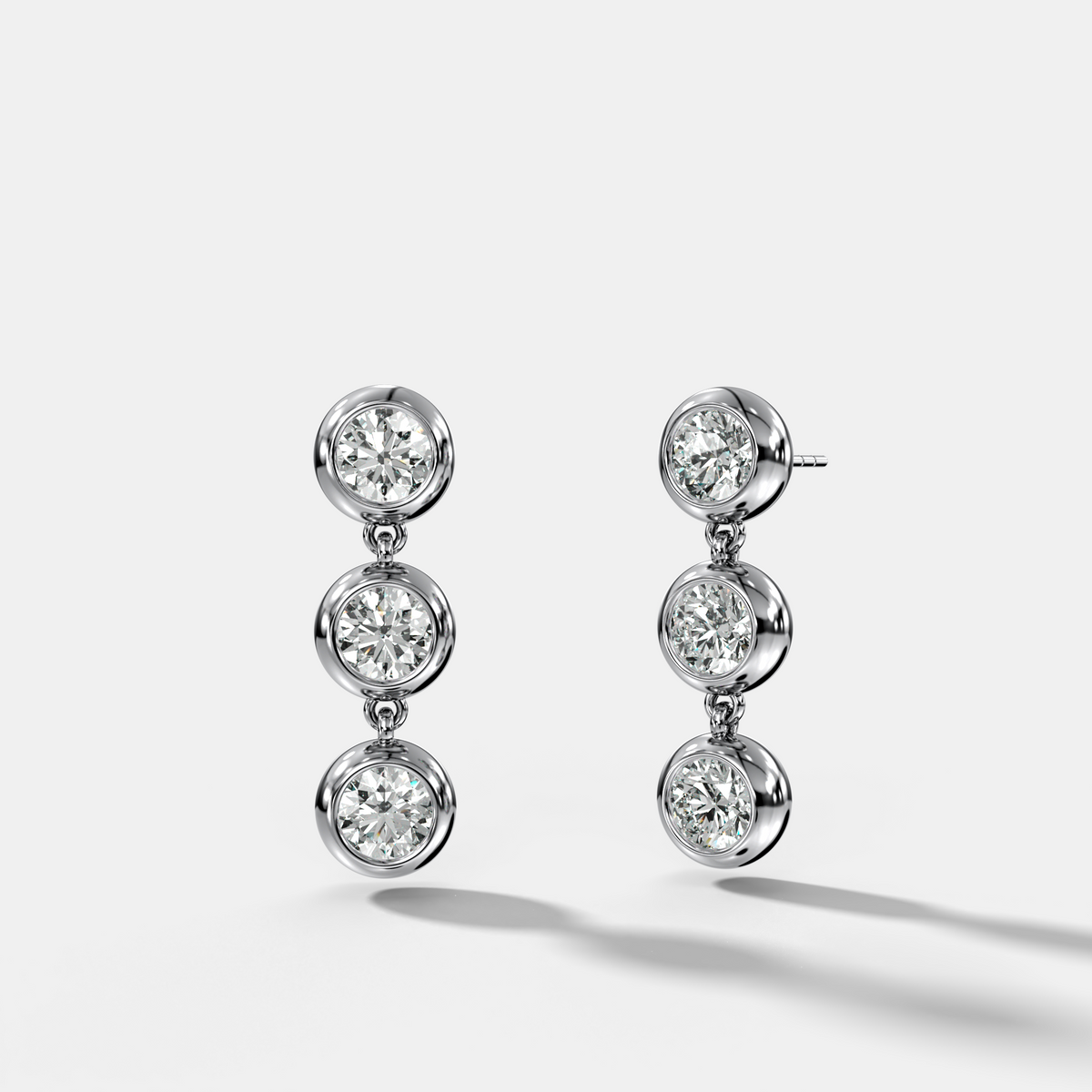 Three Stone Bezel Drop Earrings with Round Cut Diamonds
