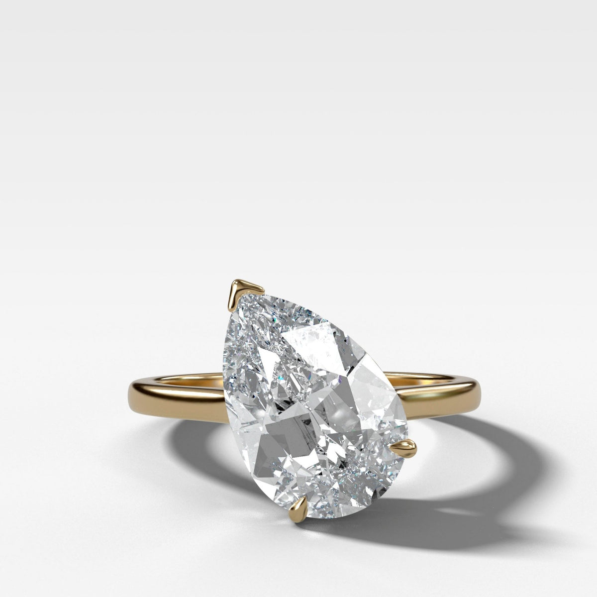 Tilted Thin + Simple Solitaire Engagement Ring With Pear Cut Diamond - GOODSTONE