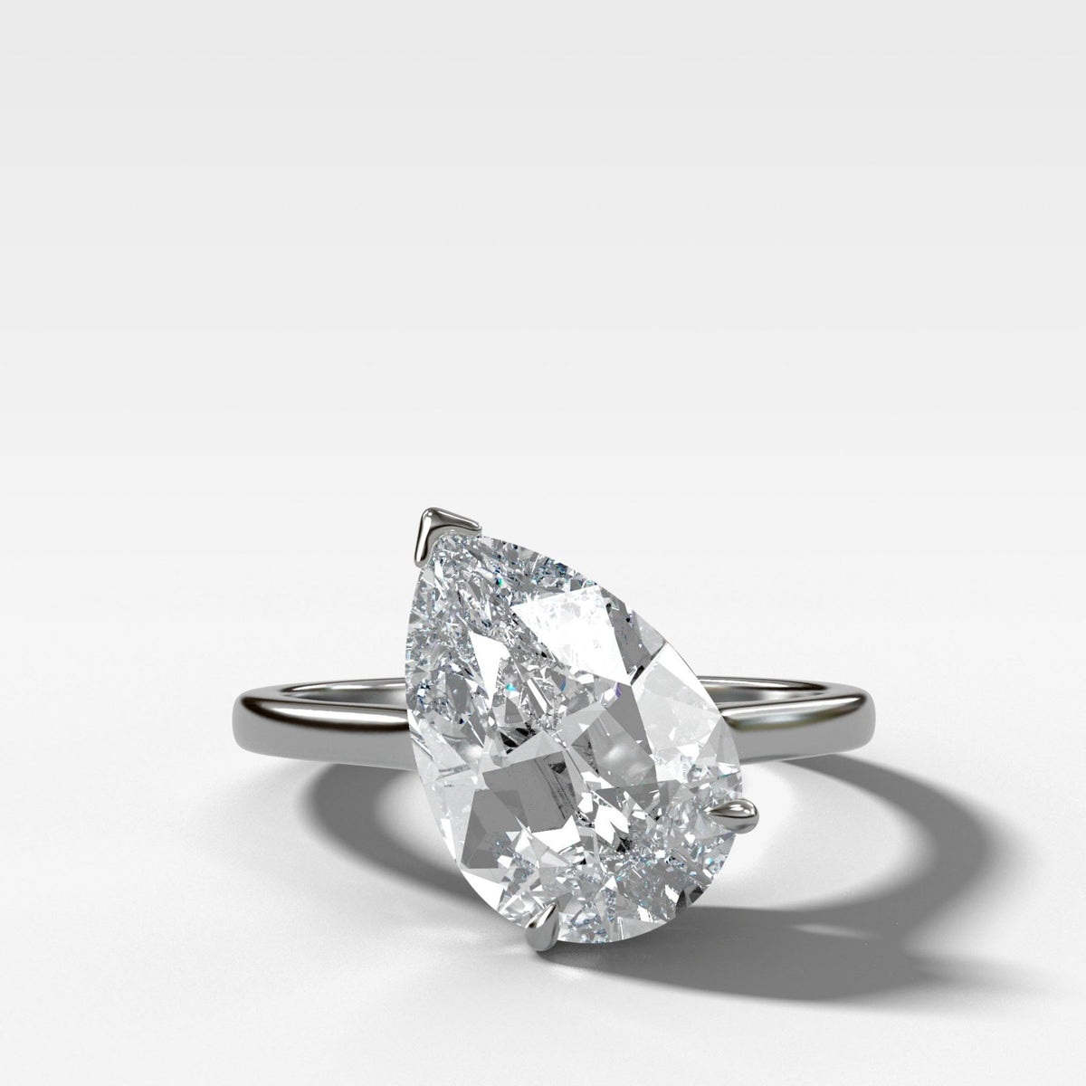 Tilted Thin + Simple Solitaire Engagement Ring With Pear Cut Diamond - GOODSTONE