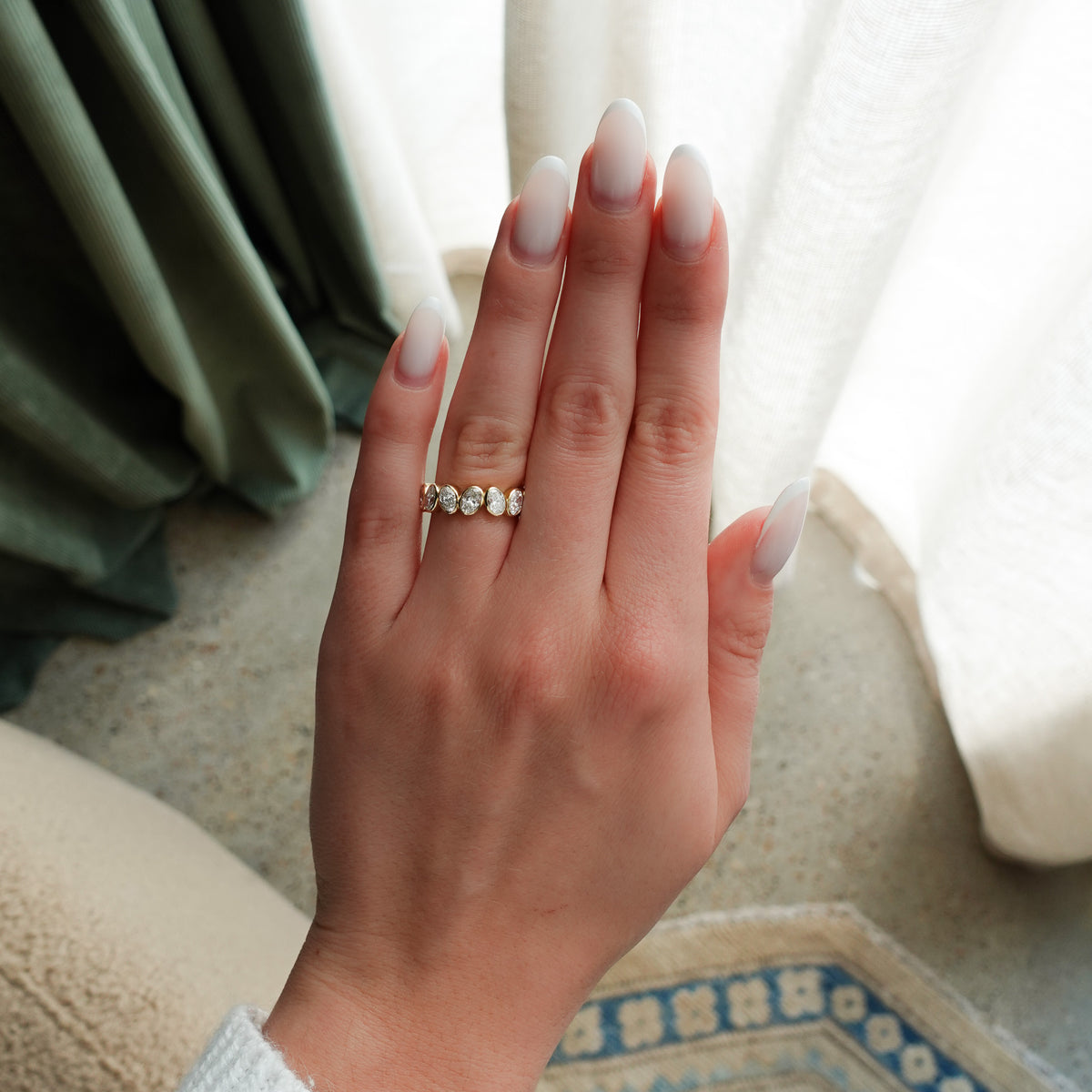 Tilted Bezel Set Eternity Band with Oval Cuts