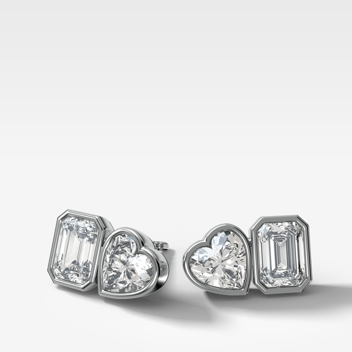Toi et Moi Bezel Set Diamond Studs with Emerald and Heart Cuts - GOODSTONE
