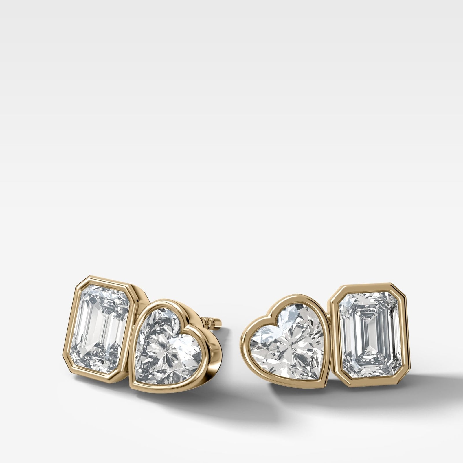 Toi et Moi Bezel Set Diamond Studs with Emerald and Heart Cuts - GOODSTONE