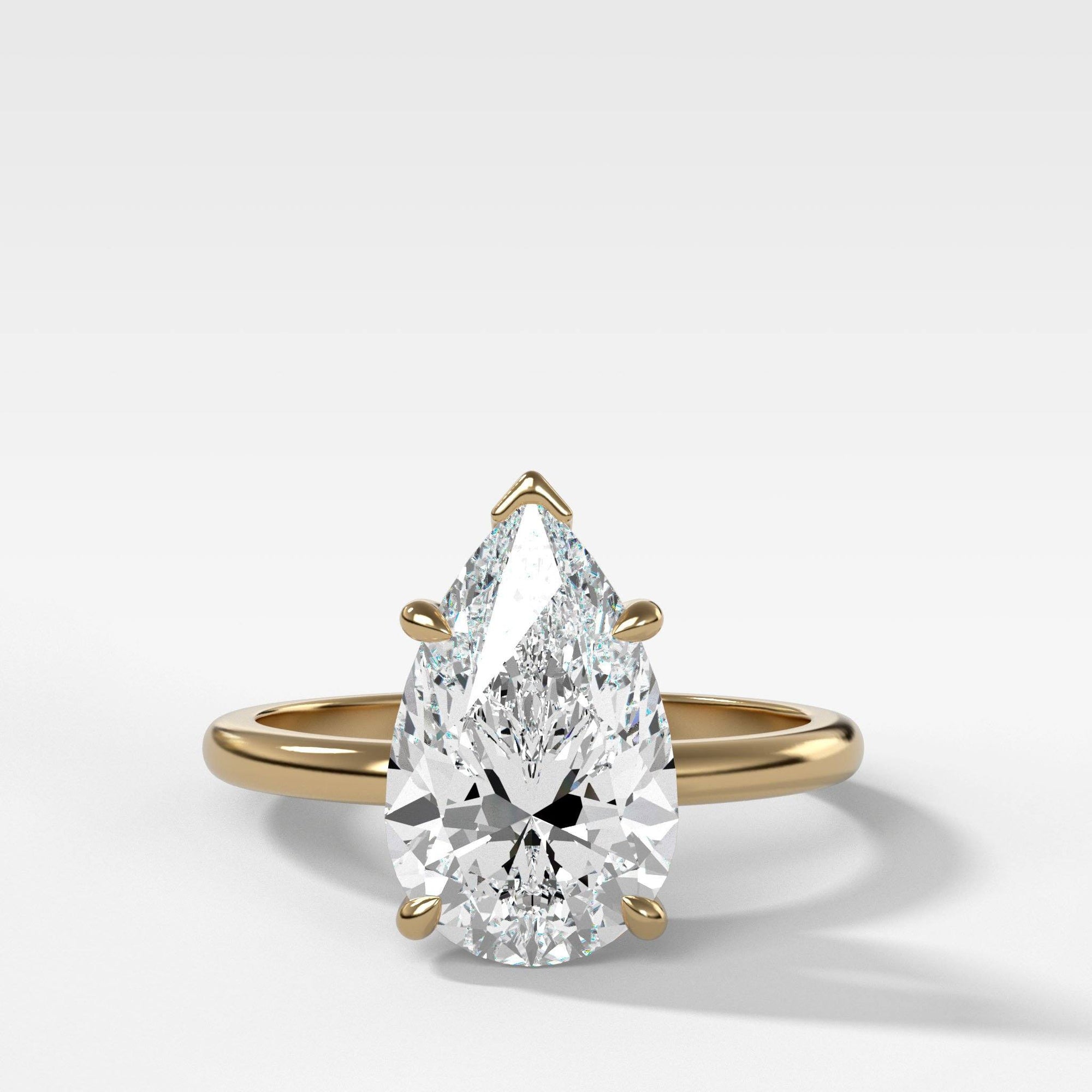 Crescent Solitaire With Pear Cut by Good Stone in Yellow Gold