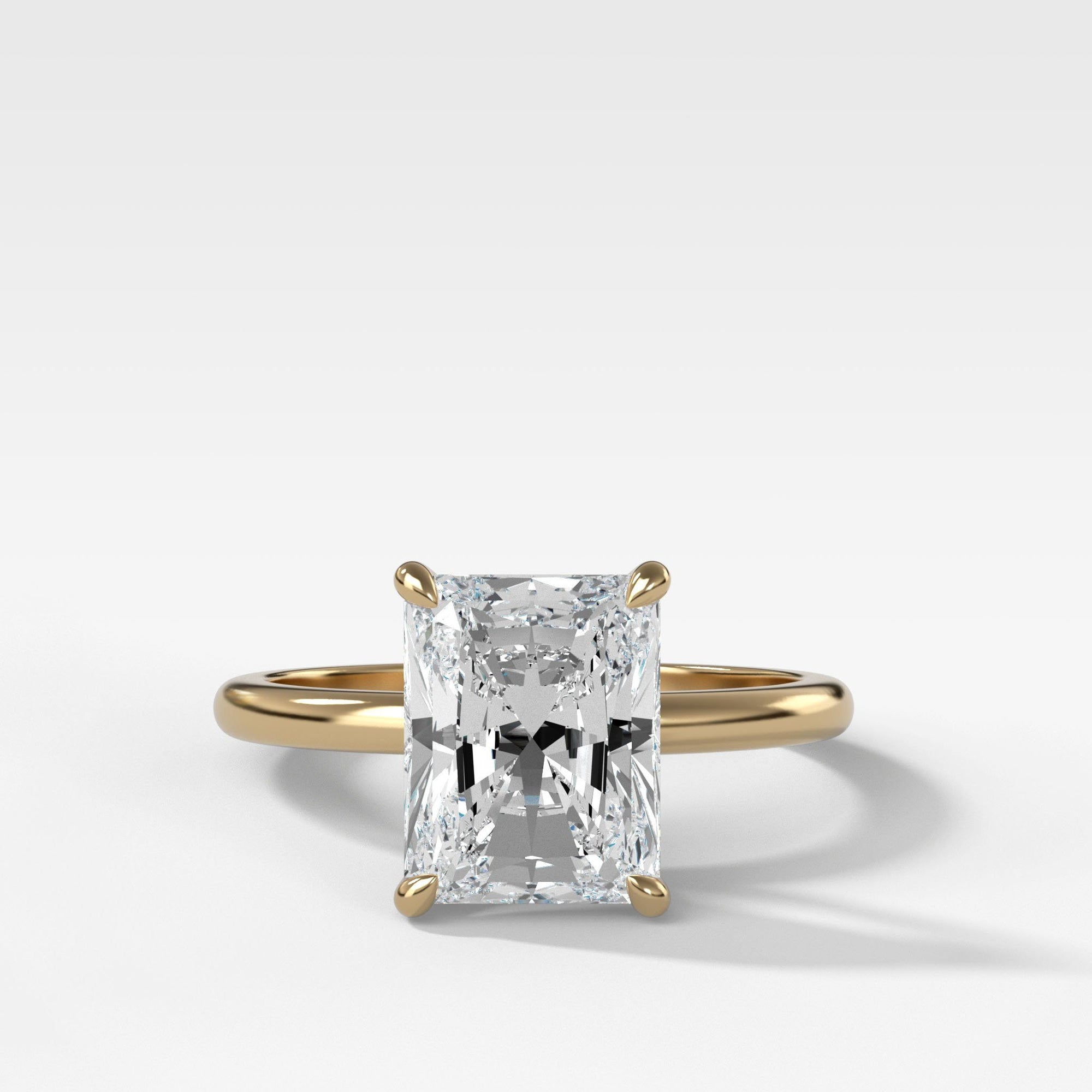 Crescent Solitaire With Radiant Cut by Good Stone in Yellow Gold