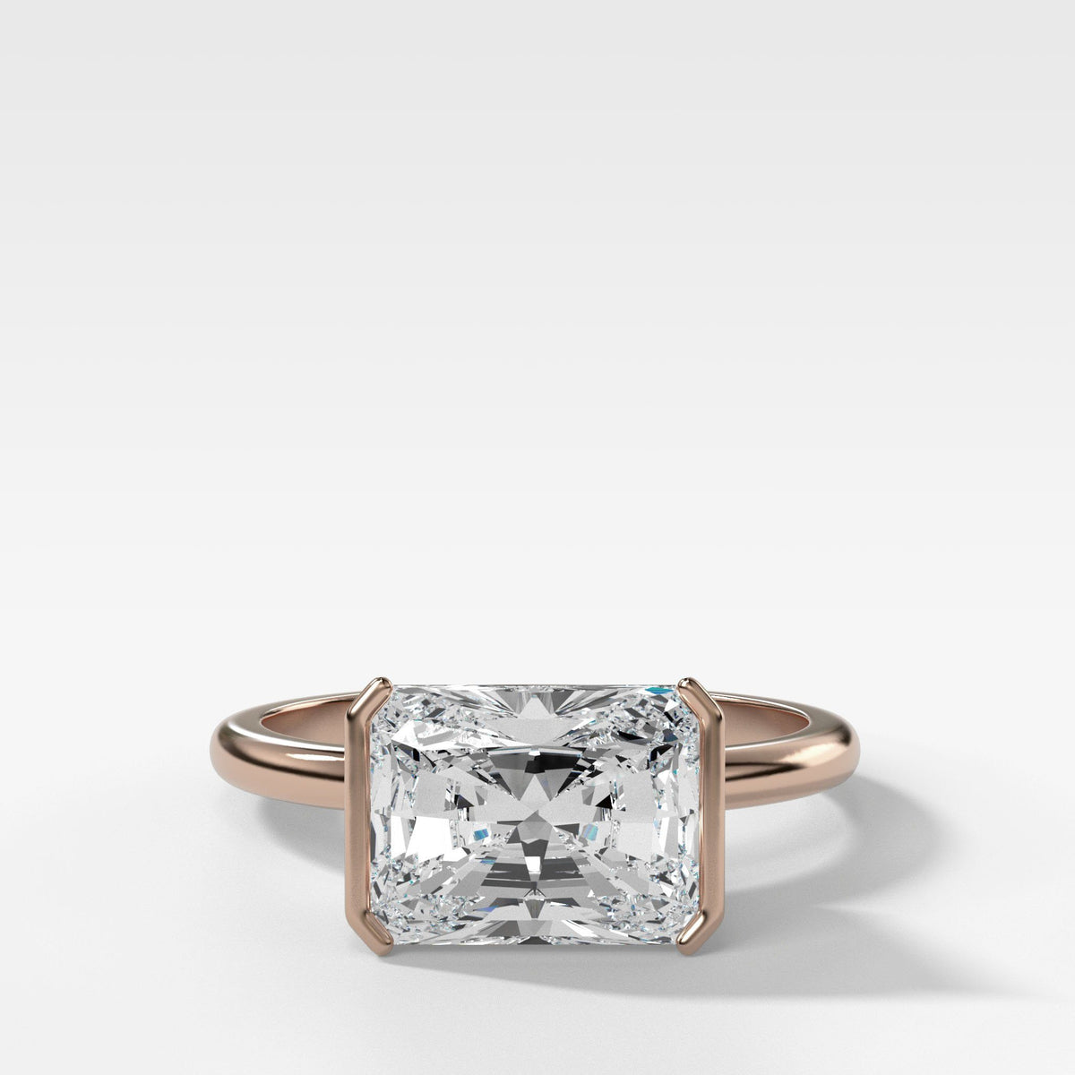 Half Bezel Solitaire Engagement ring with Elongated Radiant Cut by Good Stone in Rose Gold