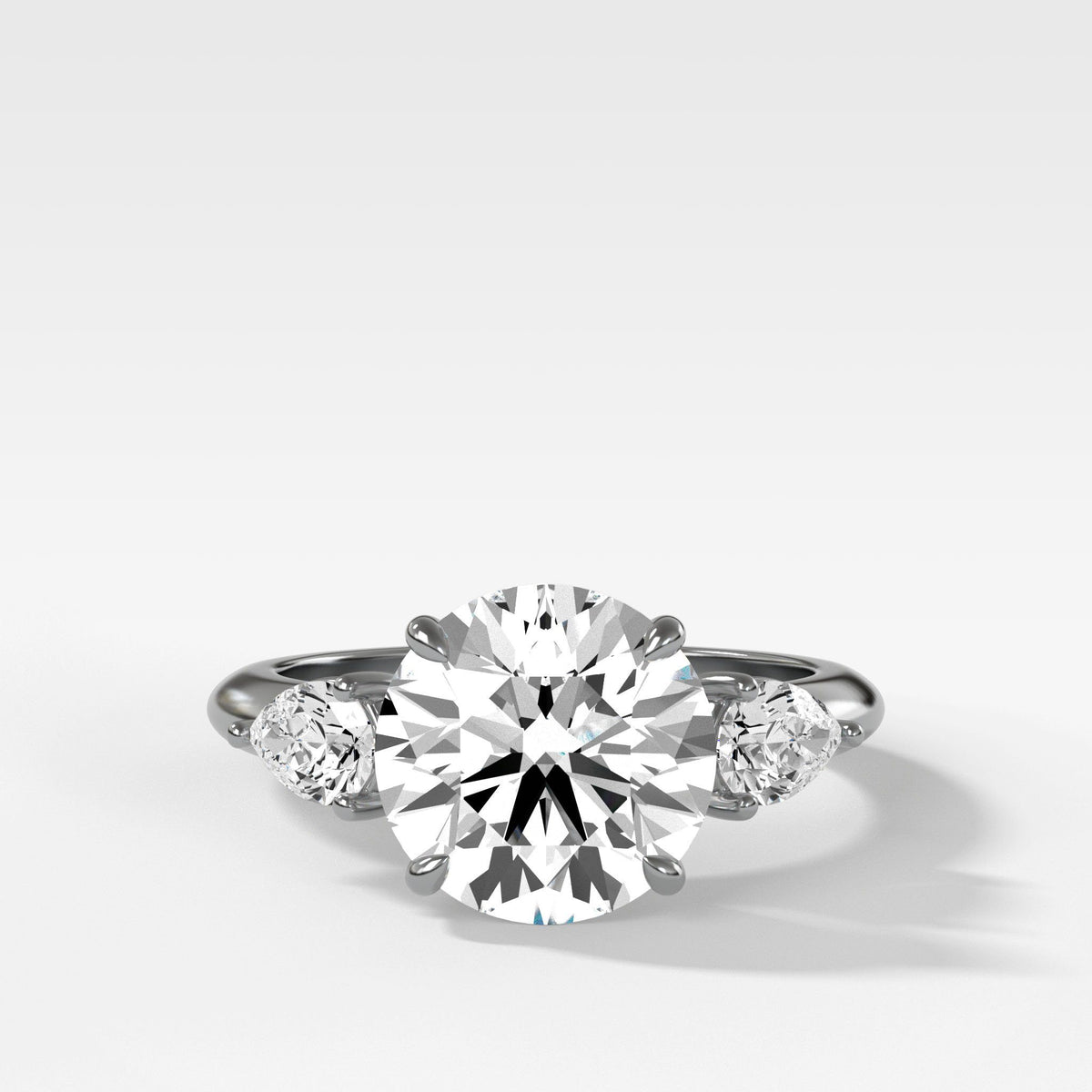 Three Stone Engagement Ring With Pear Side Stones And Round Cut by Good Stone in White Gold