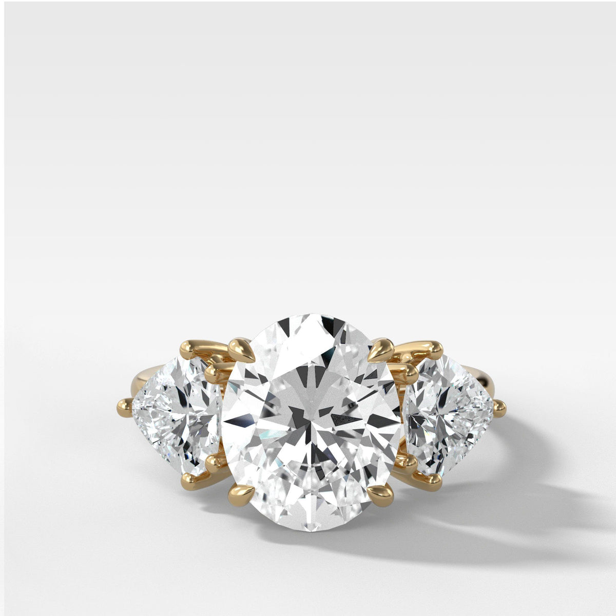 Three Stone Engagement Ring With Epaulette Cut Diamond Sides by Good Stone in Yellow Gold