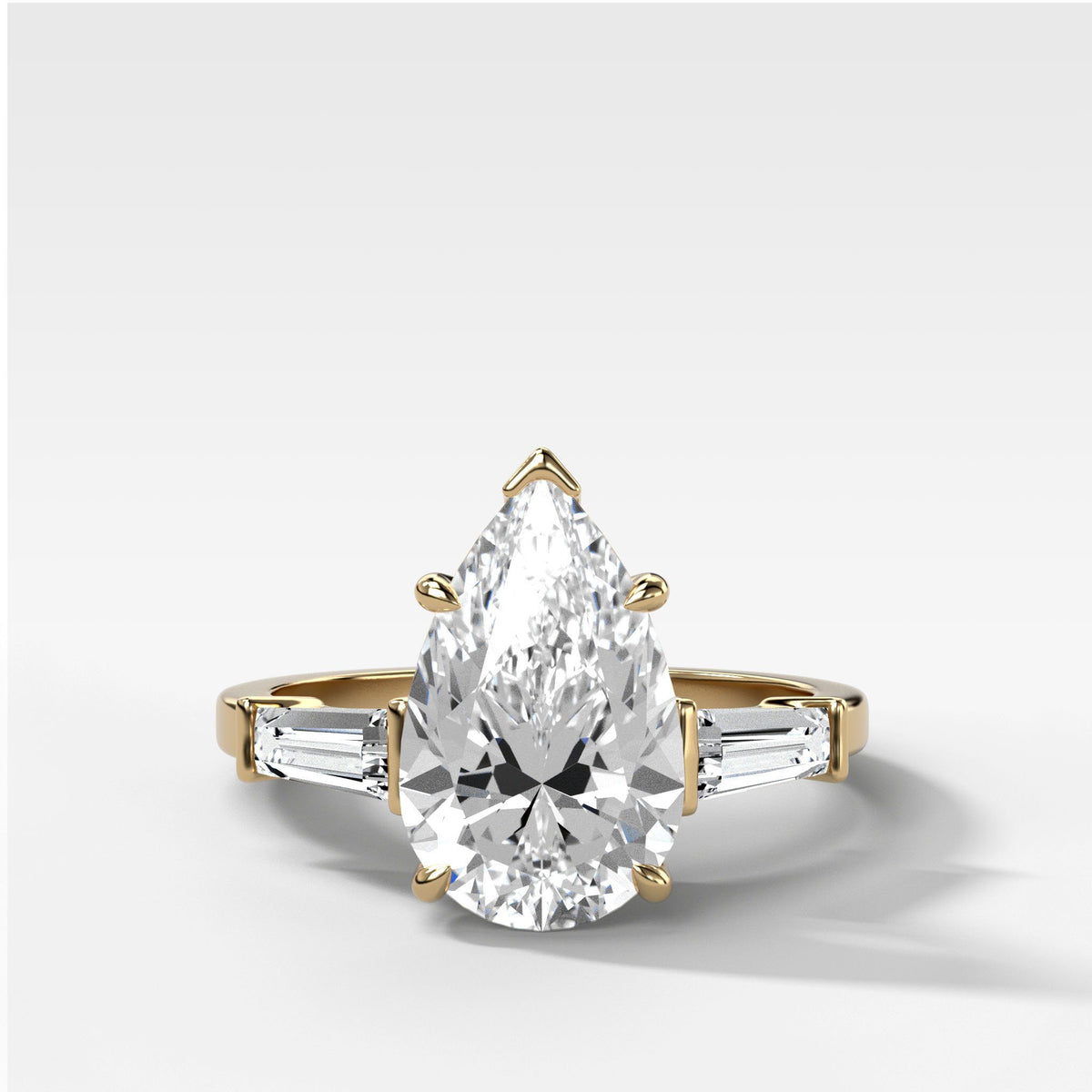 1.5 carat diamonds with tapered baguettes, pear, or shield side stones!