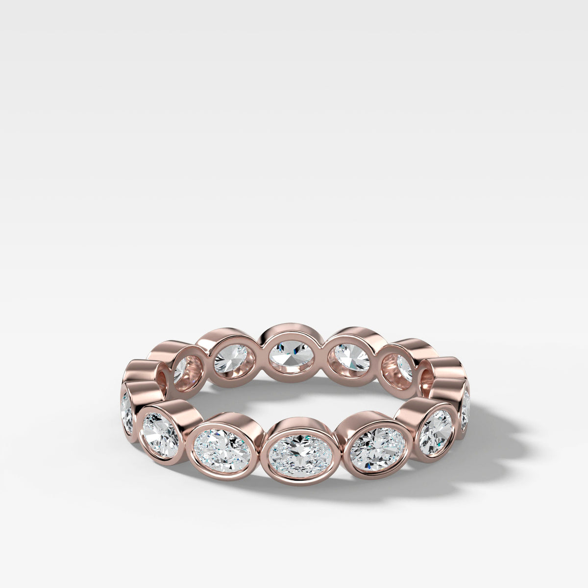 Baby Bezel Set Eternity Band With East West Oval Cuts in Rose Gold by Good Stone