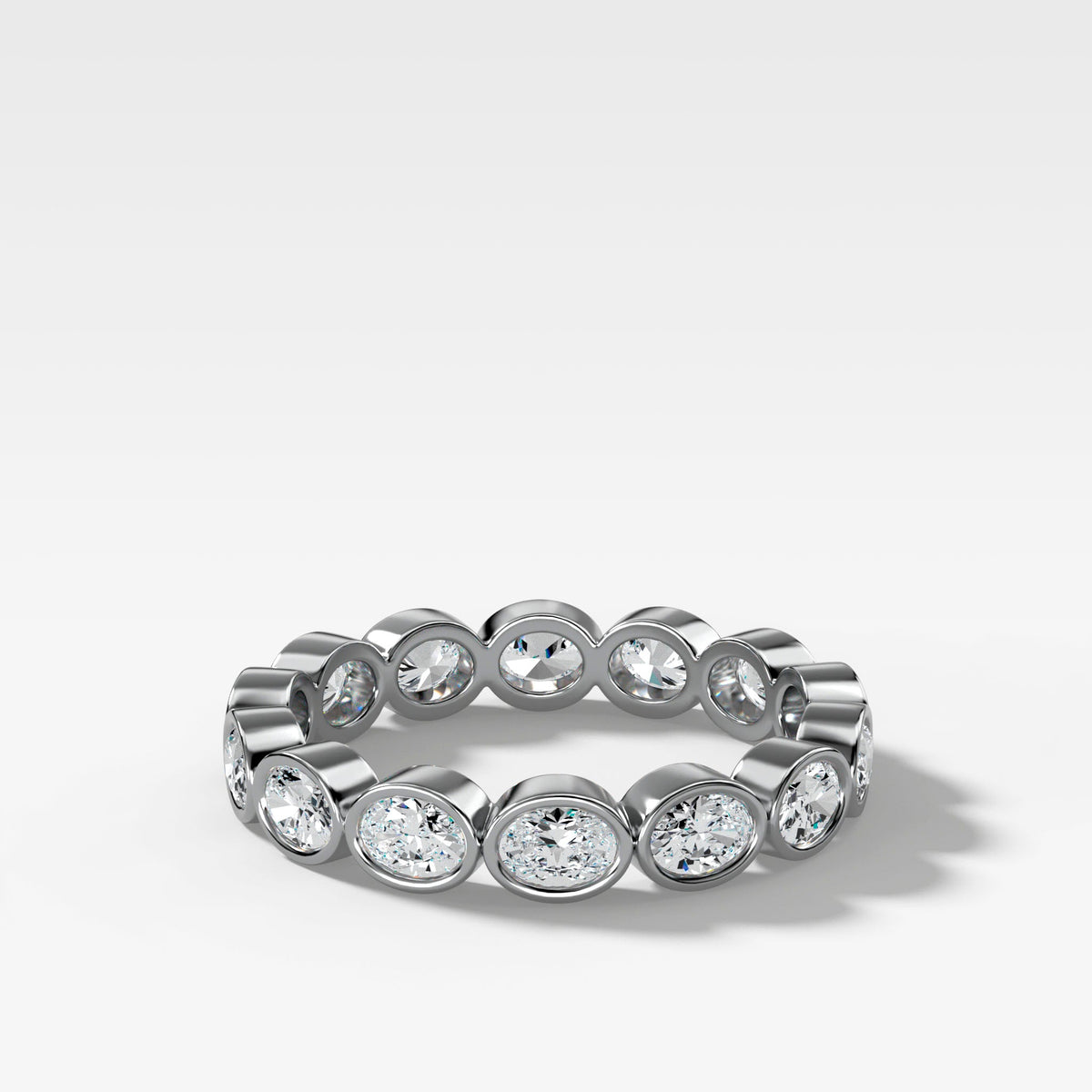 Baby Bezel Set Eternity Band With East West Oval Cuts in White Gold by Good Stone
