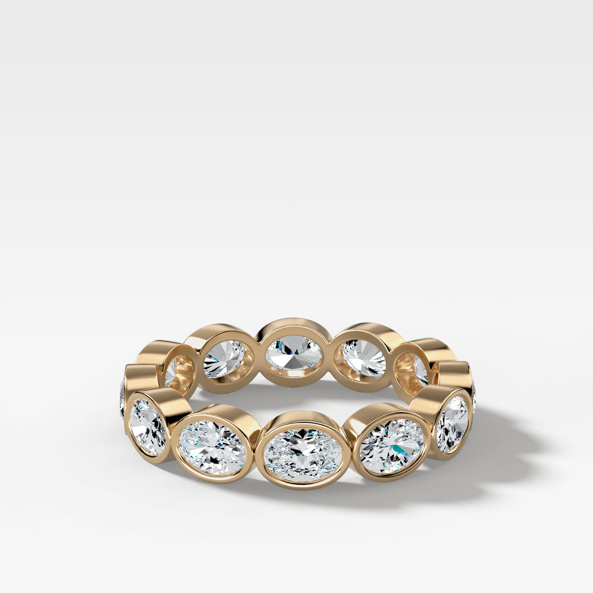 Midi Bezel Set Eternity Band With East West Oval Cuts in Yellow Gold by Good Stone