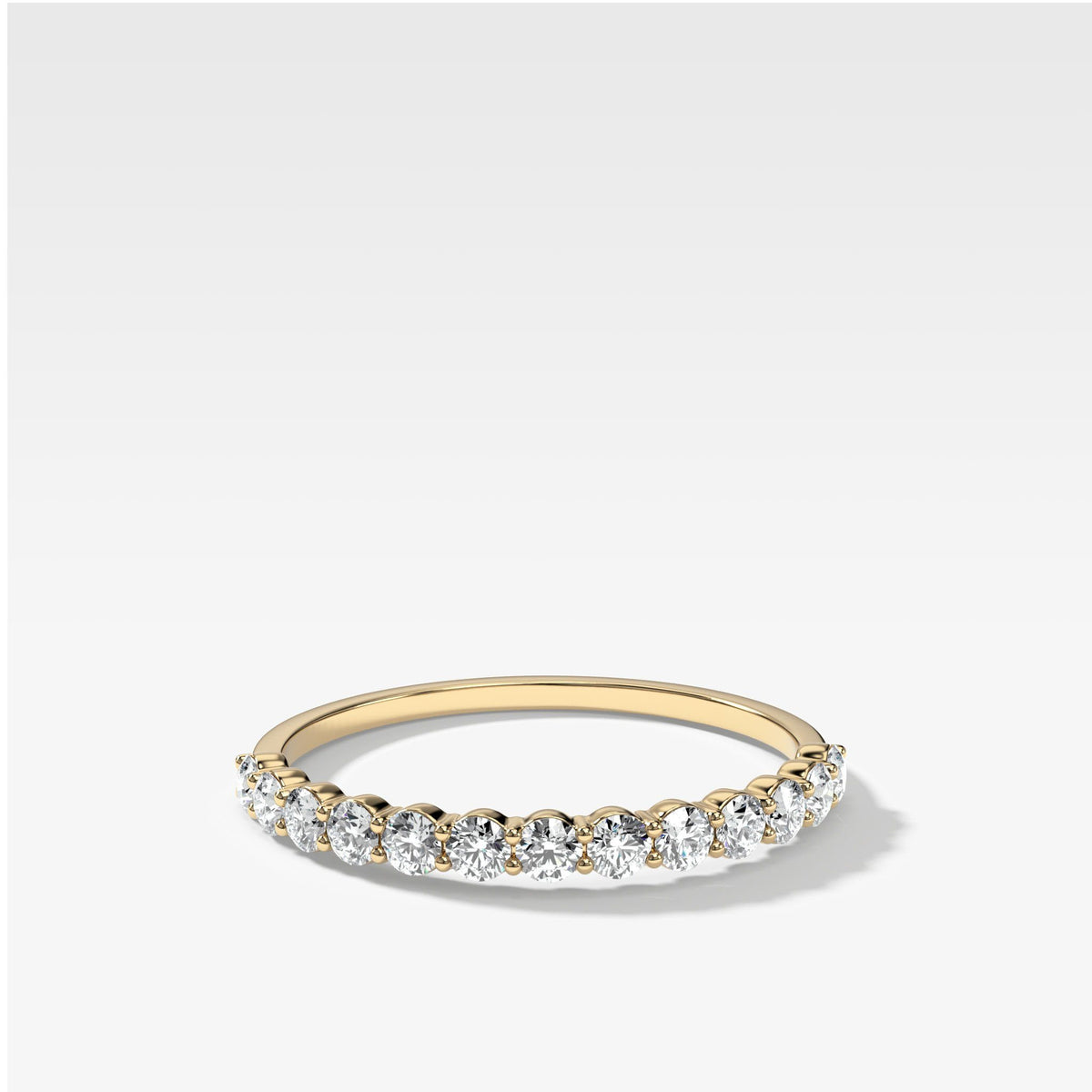 Petite Shared Prong Wedding Band by Good Stone in Yellow Gold