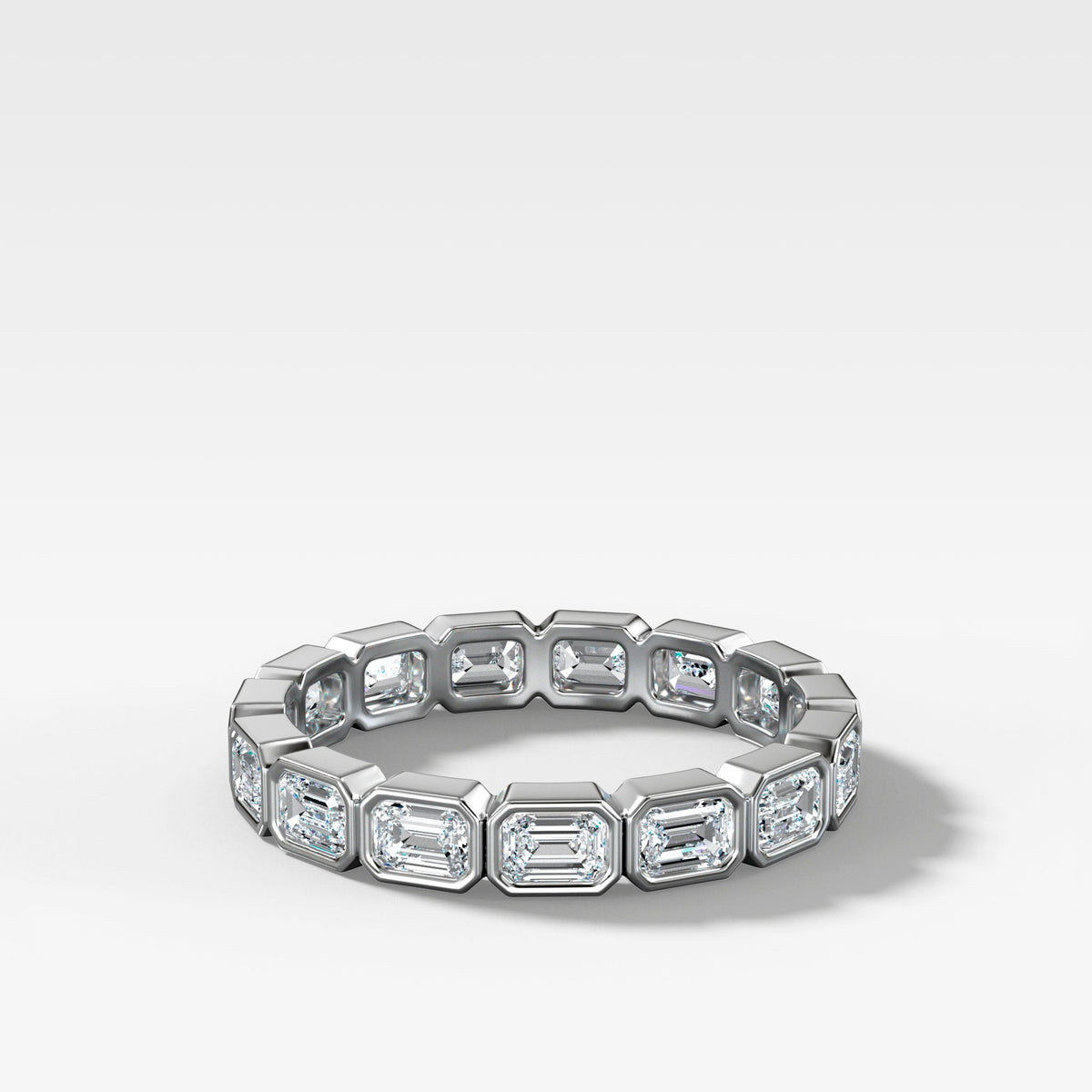 Baby Bezel Set Eternity Band With East West Emerald Cuts in White Gold by Good Stone