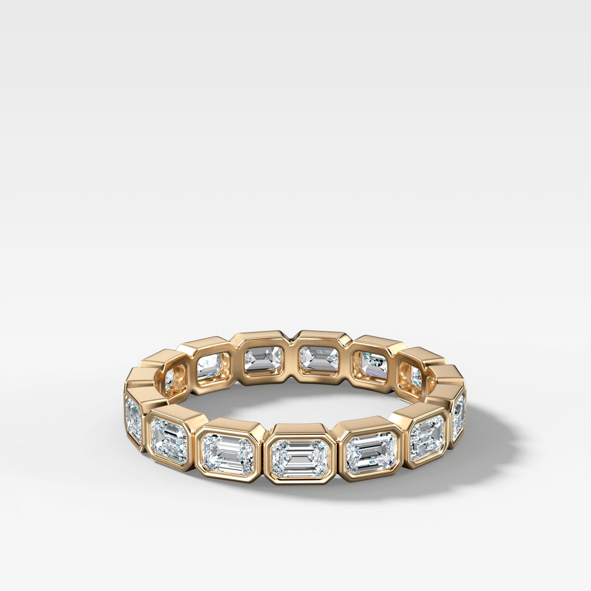 Baby Bezel Set Eternity Band With East West Emerald Cuts in Yellow Gold by Good Stone