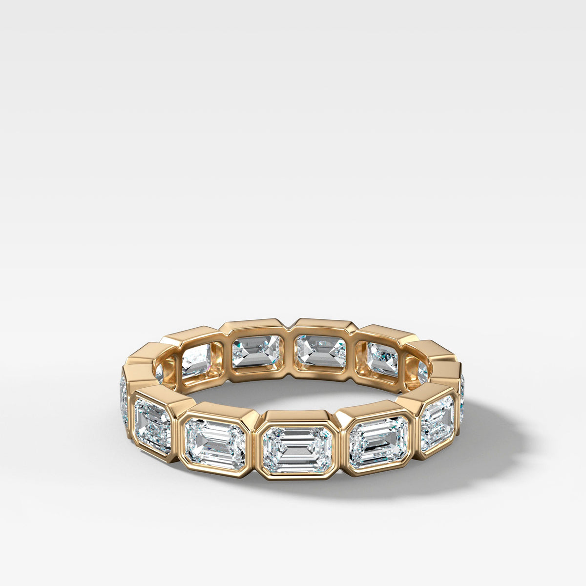 Midi Bezel Set Eternity Band With East West Emerald Cuts in Yellow Gold by Good Stone
