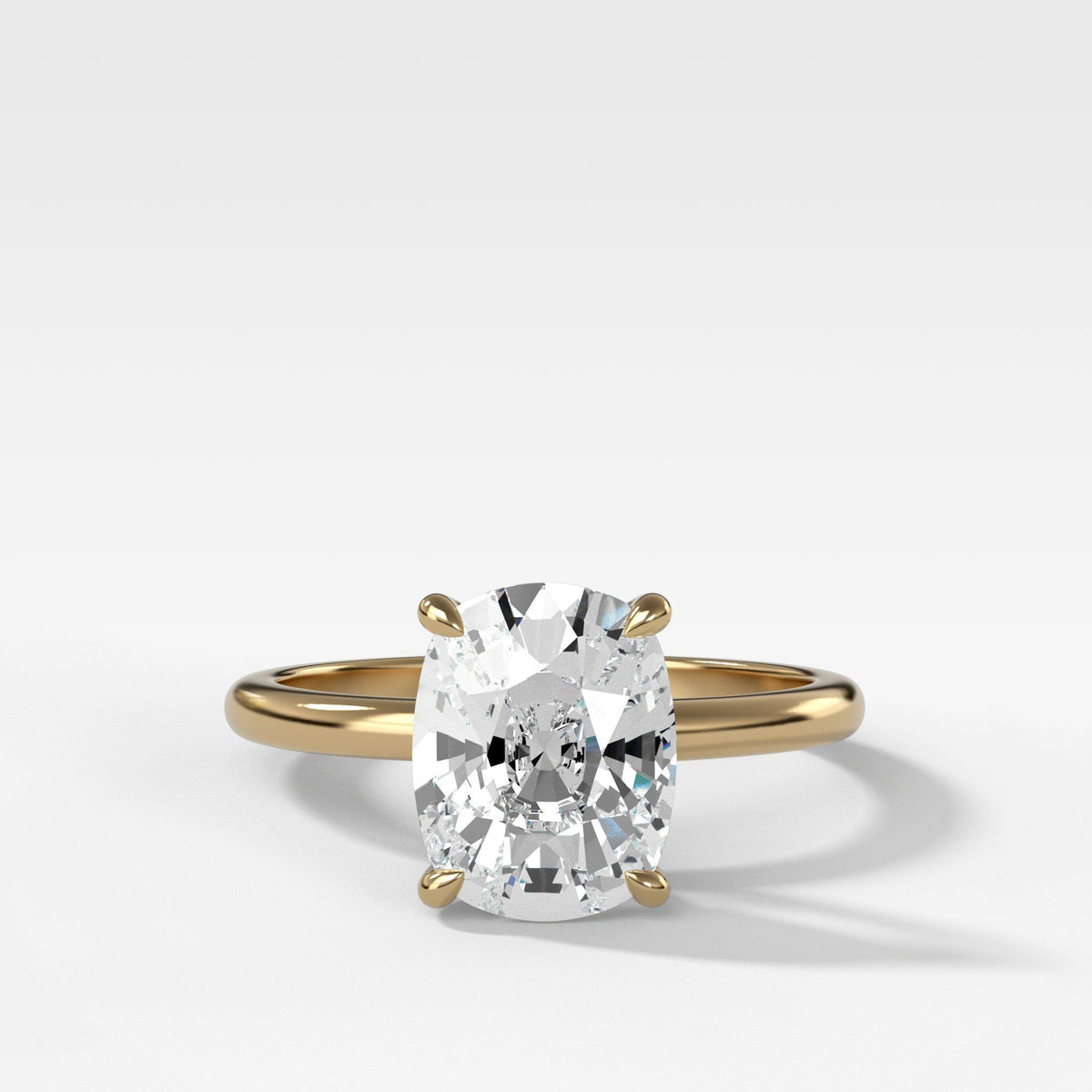 Crescent Solitaire With Elongated Cushion Cut by Good Stone in Yellow Gold
