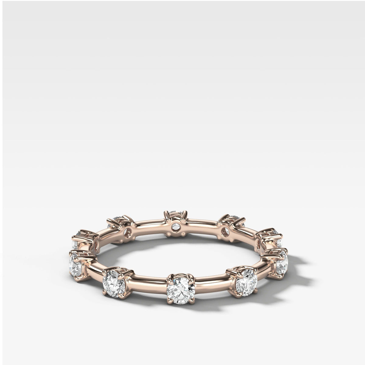 Claw Diamond Band: Spaced Eternity Band by Good Stone in Rose Gold