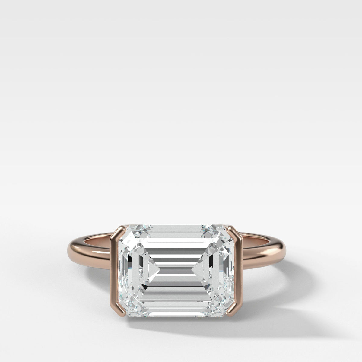 East West Half Bezel Solitaire Engagement Ring With Emerald Cut by Good Stone in Rose Gold