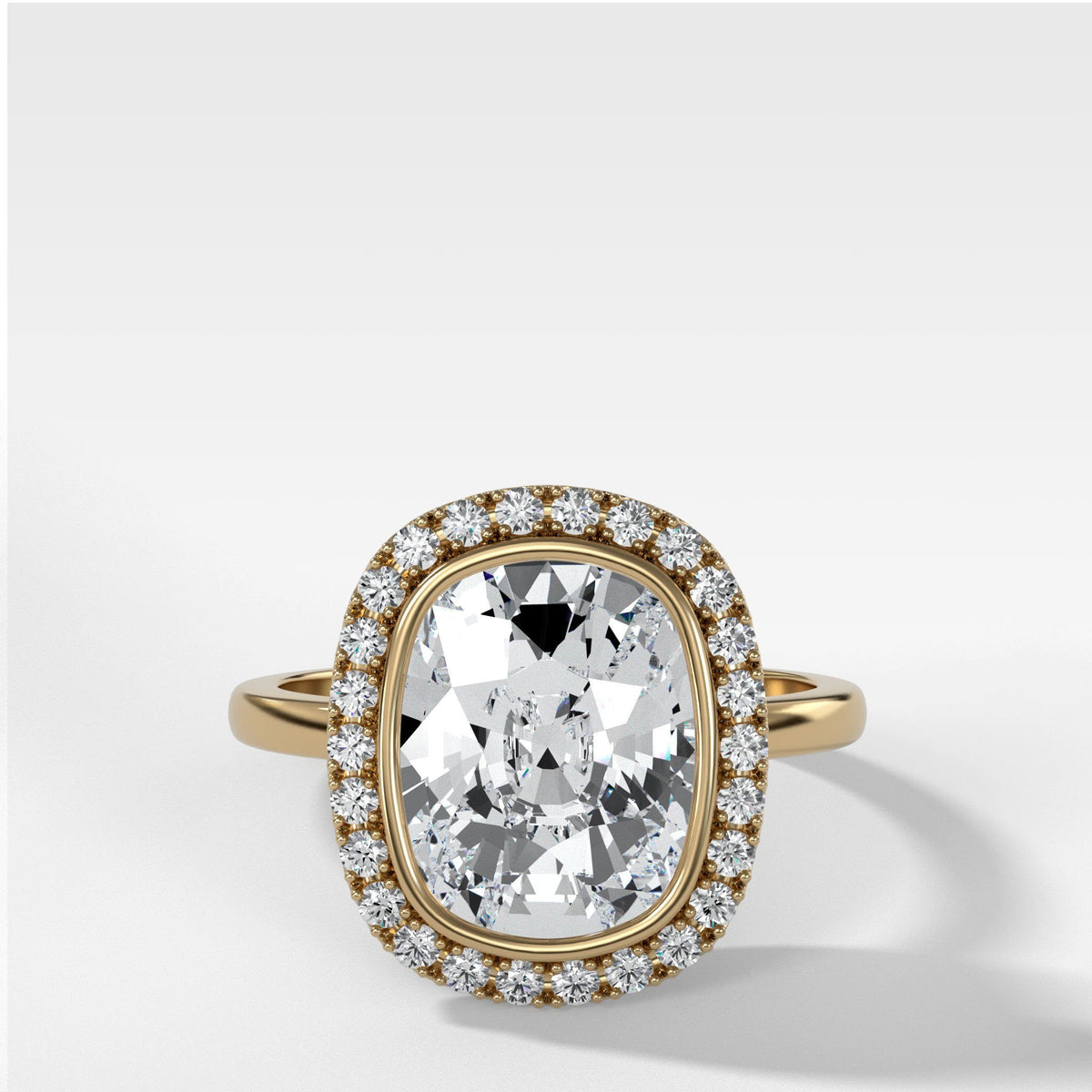 Bezel Set Halo Engagement Ring With Elongated Cushion Cut by Good Stone in Yellow Gold
