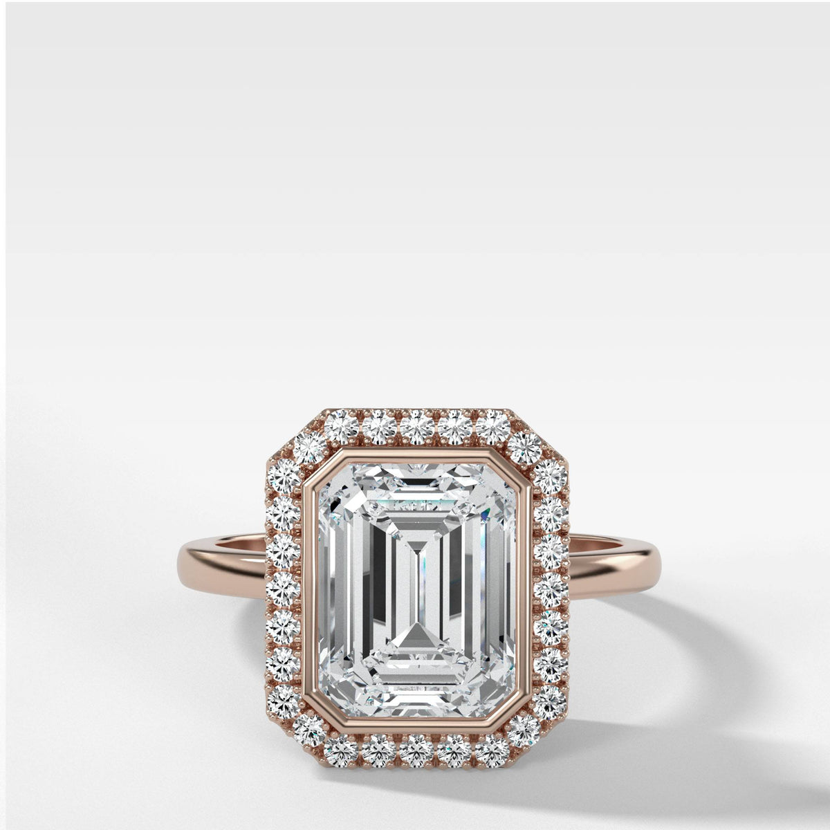 Bezel Set Halo Engagement Ring With Emerald Cut by Good Stone in Rose Gold