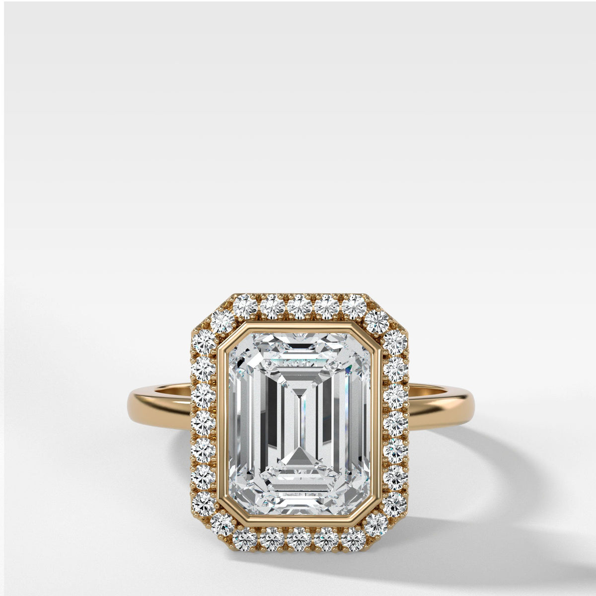 Bezel Set Halo Engagement Ring With Emerald Cut by Good Stone in Yellow Gold