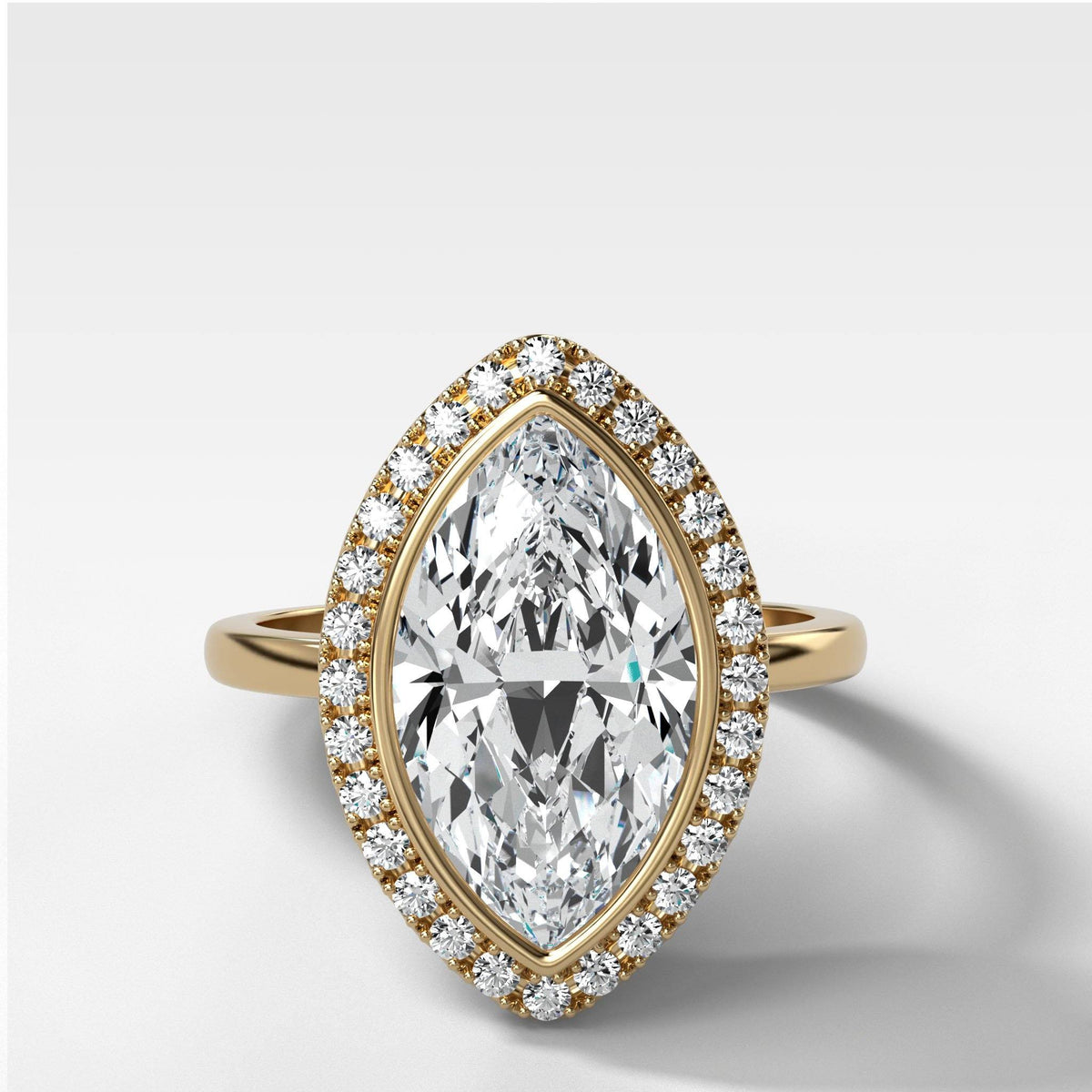 Bezel Set Halo Engagement Ring With Marquise Cut by Good Stone in Yellow Gold