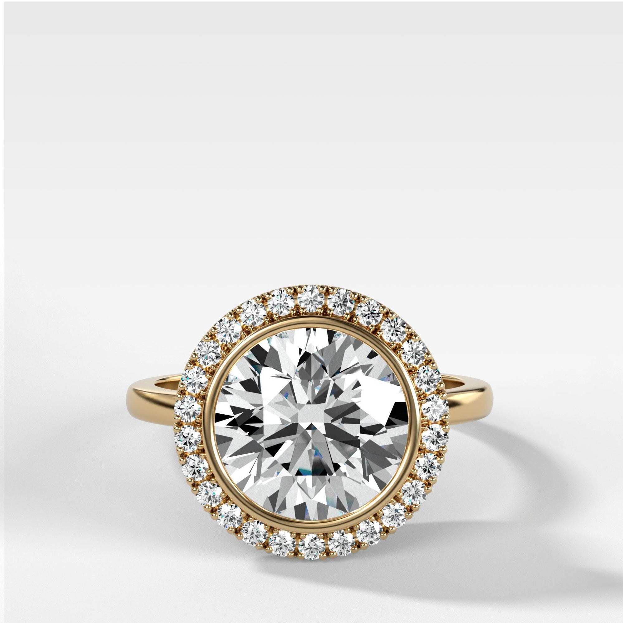 Bezel Set Halo Engagement Ring With Round Cut by Good Stone in Yellow Gold
