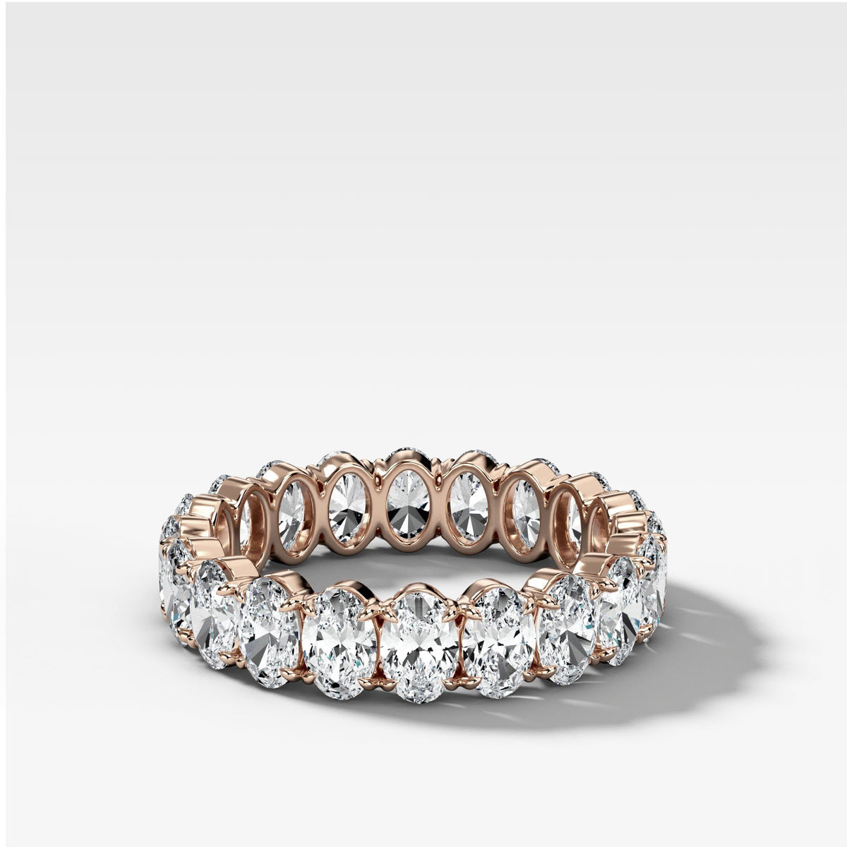 Claw Set Eternity Band With Oval Diamonds by Good Stone in Rose Gold