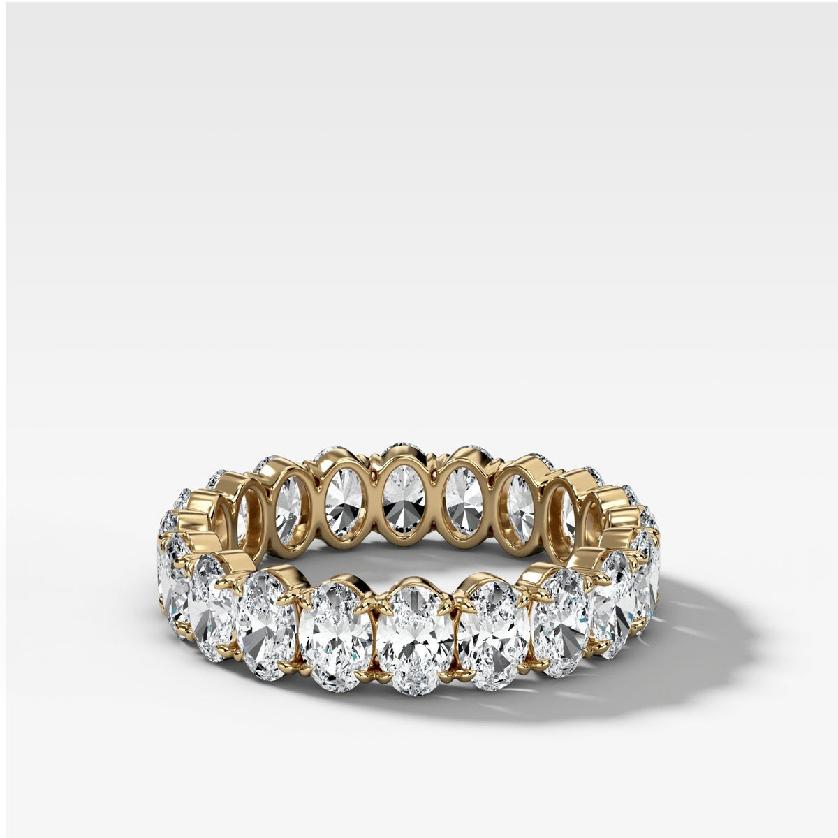 Claw Set Eternity Band With Oval Diamonds by Good Stone in Yellow Gold