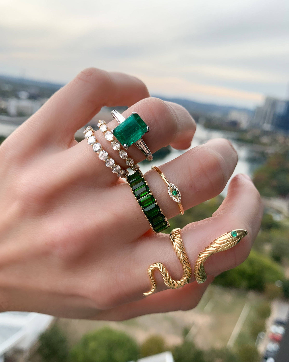 Emerald cut Emerald Translunar Ring with Tapered Baguette Diamond sides by Good Stone available in Gold and Platinum