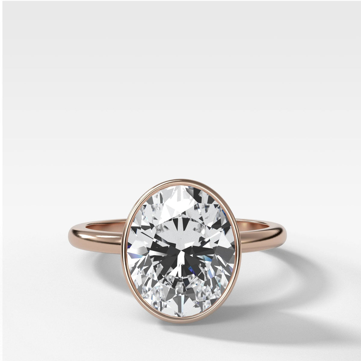 Bezel Penumbra Solitaire With Oval Cut by Good Stone in Rose Gold