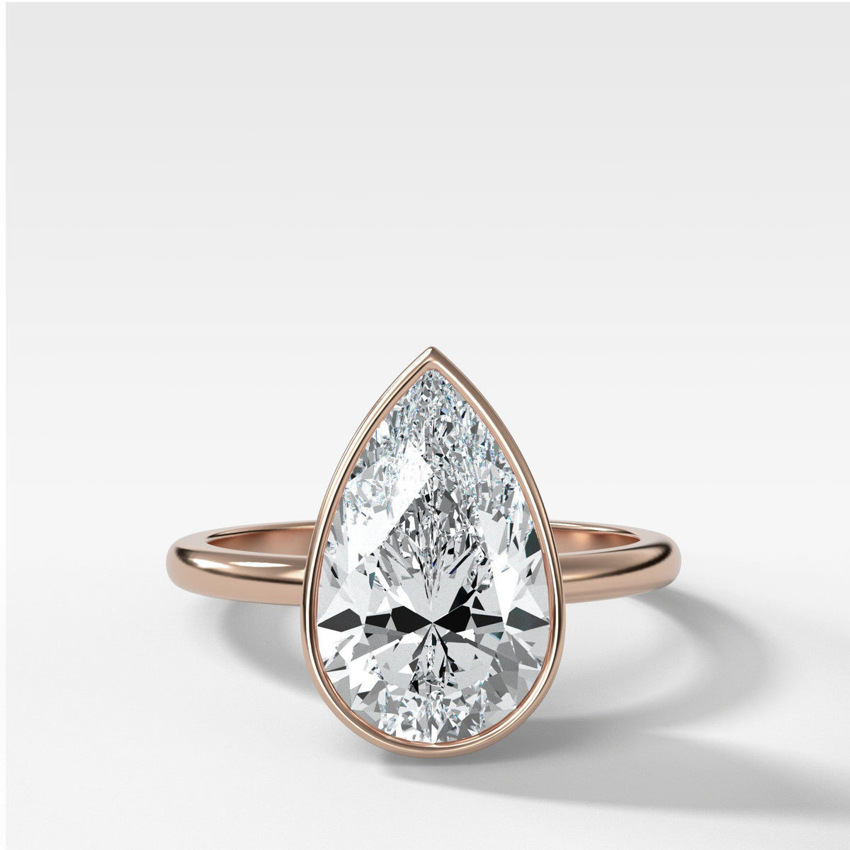 Bezel Penumbra Solitaire With Pear Cut by Good Stone in Rose Gold