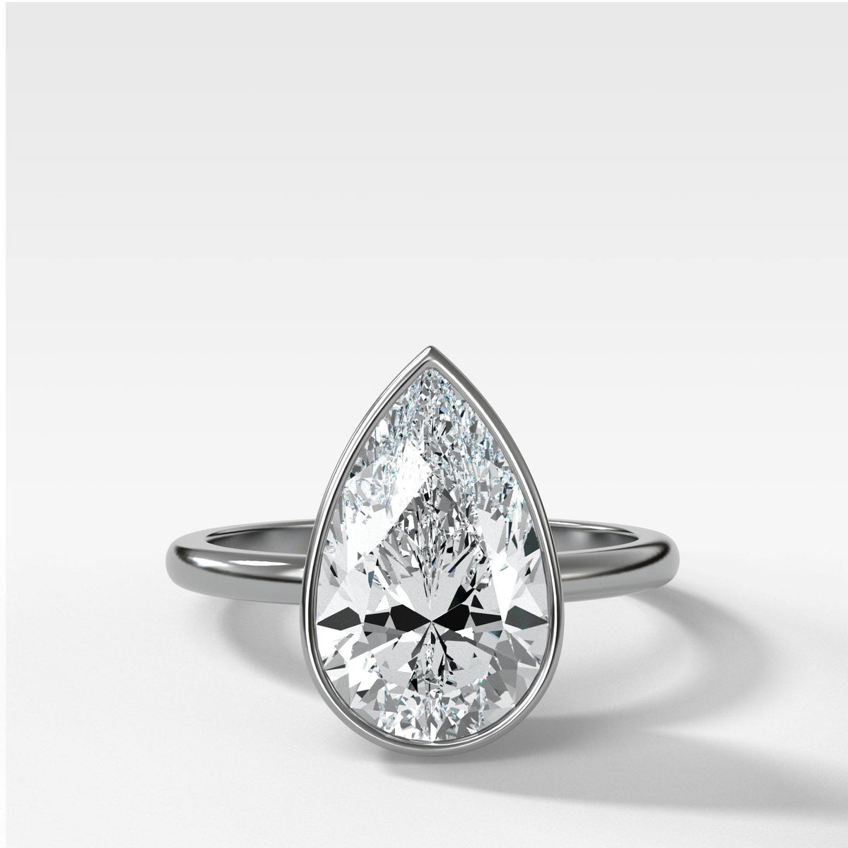 Bezel Penumbra Solitaire With Pear Cut by Good Stone in White Gold