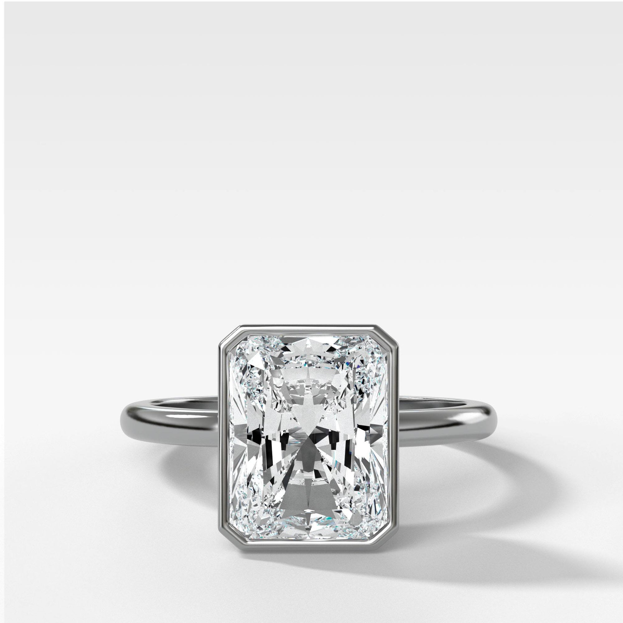 Bezel Penumbra Solitaire With Radiant Cut by Good Stone in Yellow Gold