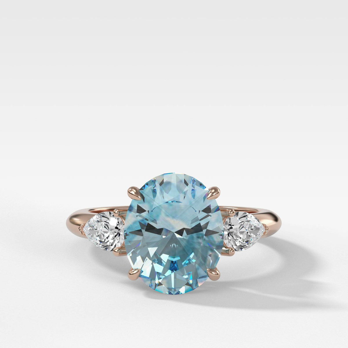 Three Stone Engagement Ring With Pear Side Stones And Aquamarine Oval Cut by Good Stone in Rose Gold