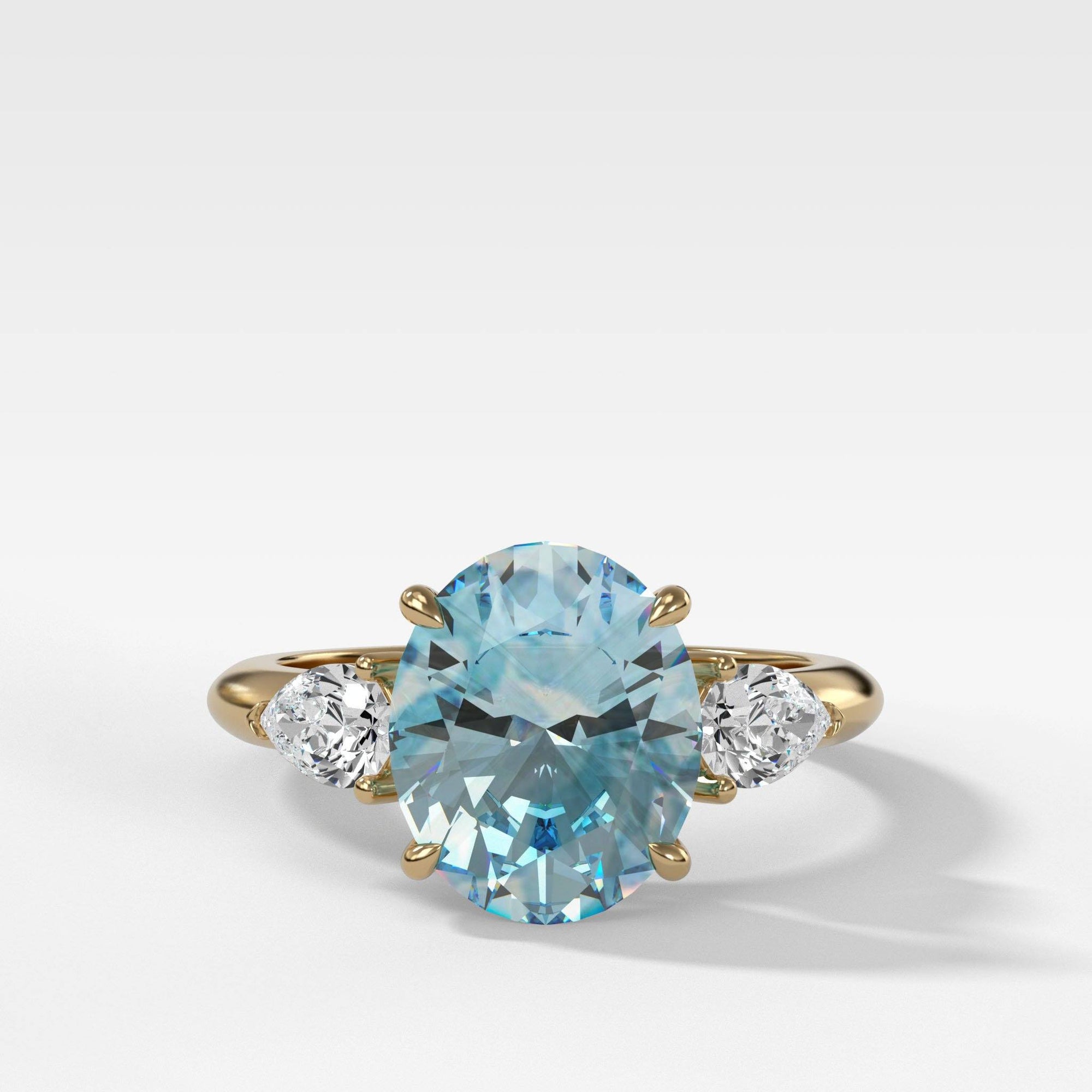 Three Stone Engagement Ring With Pear Side Stones And Aquamarine Oval Cut by Good Stone in Yellow Gold