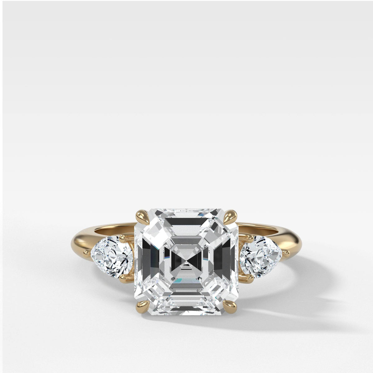 Three Stone Engagement Ring With Pear Side Stones and Asscher Cut by Good Stone in Yellow Gold