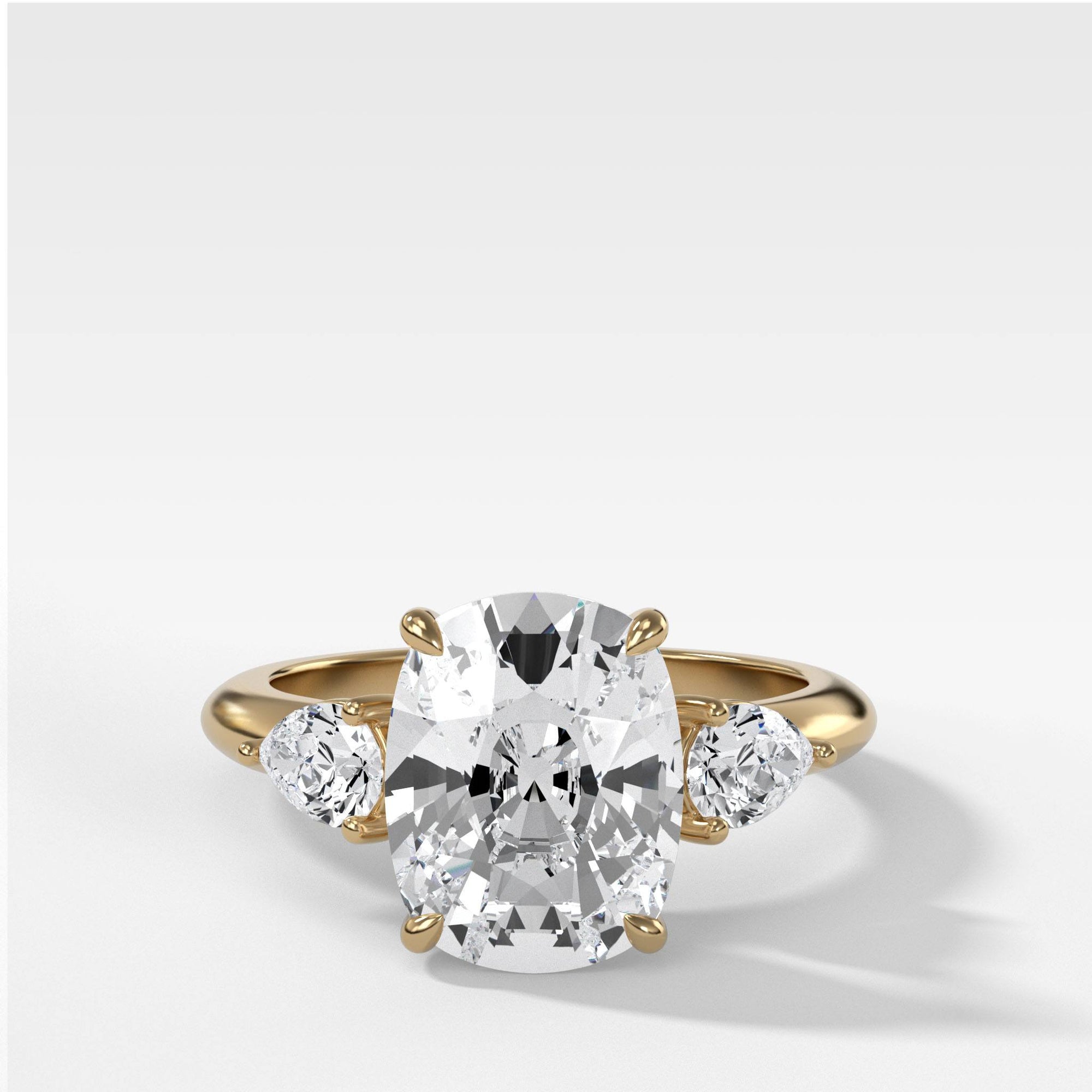 Three Stone Engagement Ring With Pear Side Stones and Elongated Cushion Cut by Good Stone in Yellow Gold