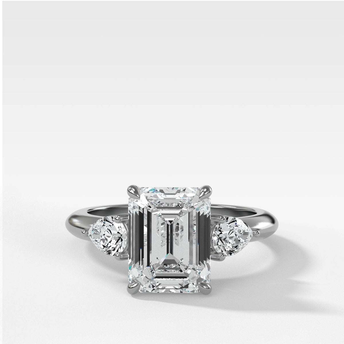 Three Stone Engagement Ring With Pear Side Stones and Emerald Cut by Good Stone in White Gold