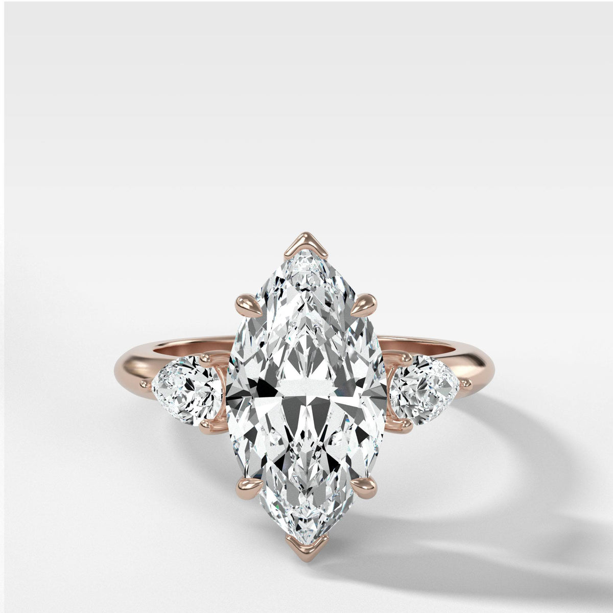 Three Stone Engagement Ring With Pear Side Stones and Marquise Cut by Good Stone in Rose Gold