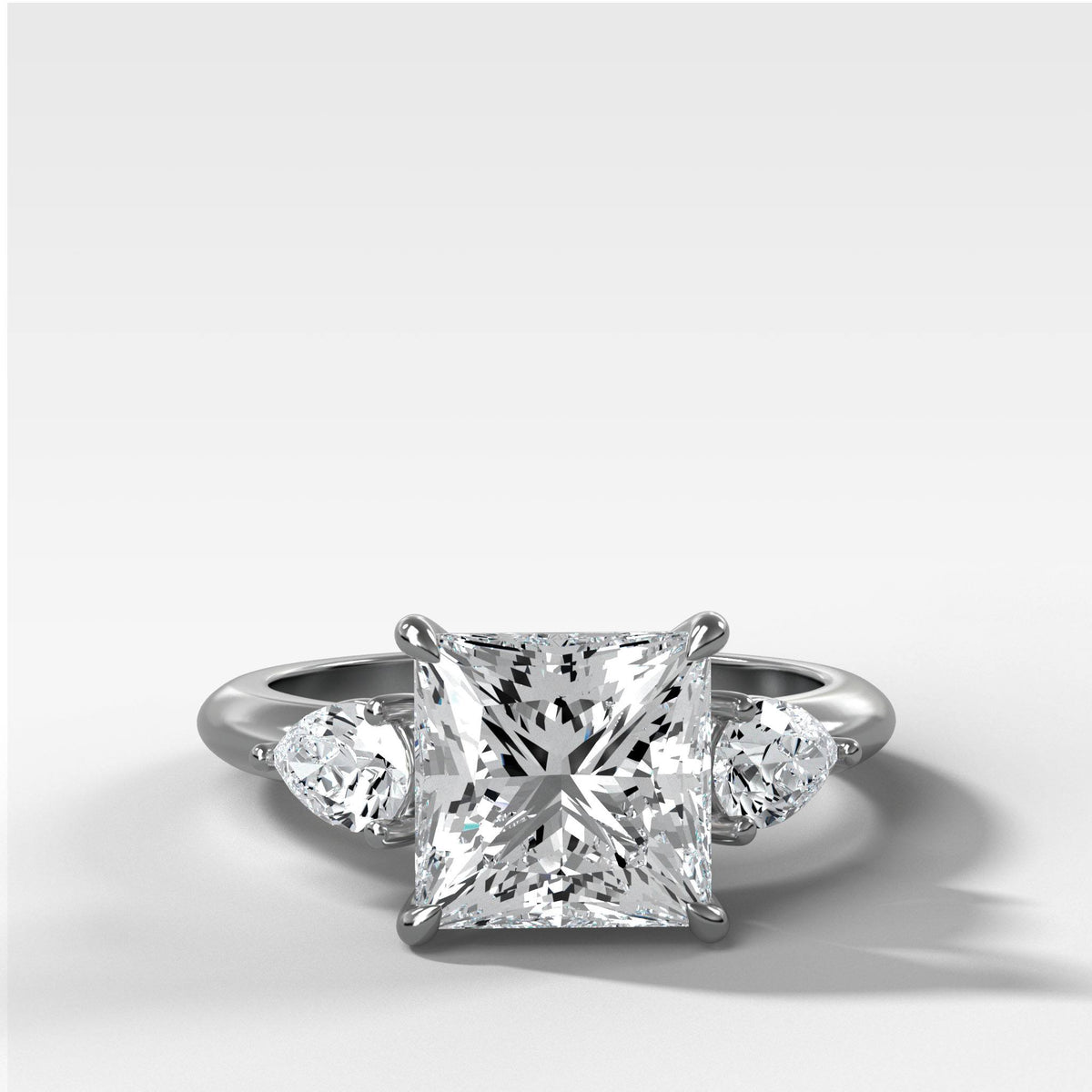 Three Stone Engagement Ring With Pear Side Stones and Princess Cut by Good Stone in White Gold
