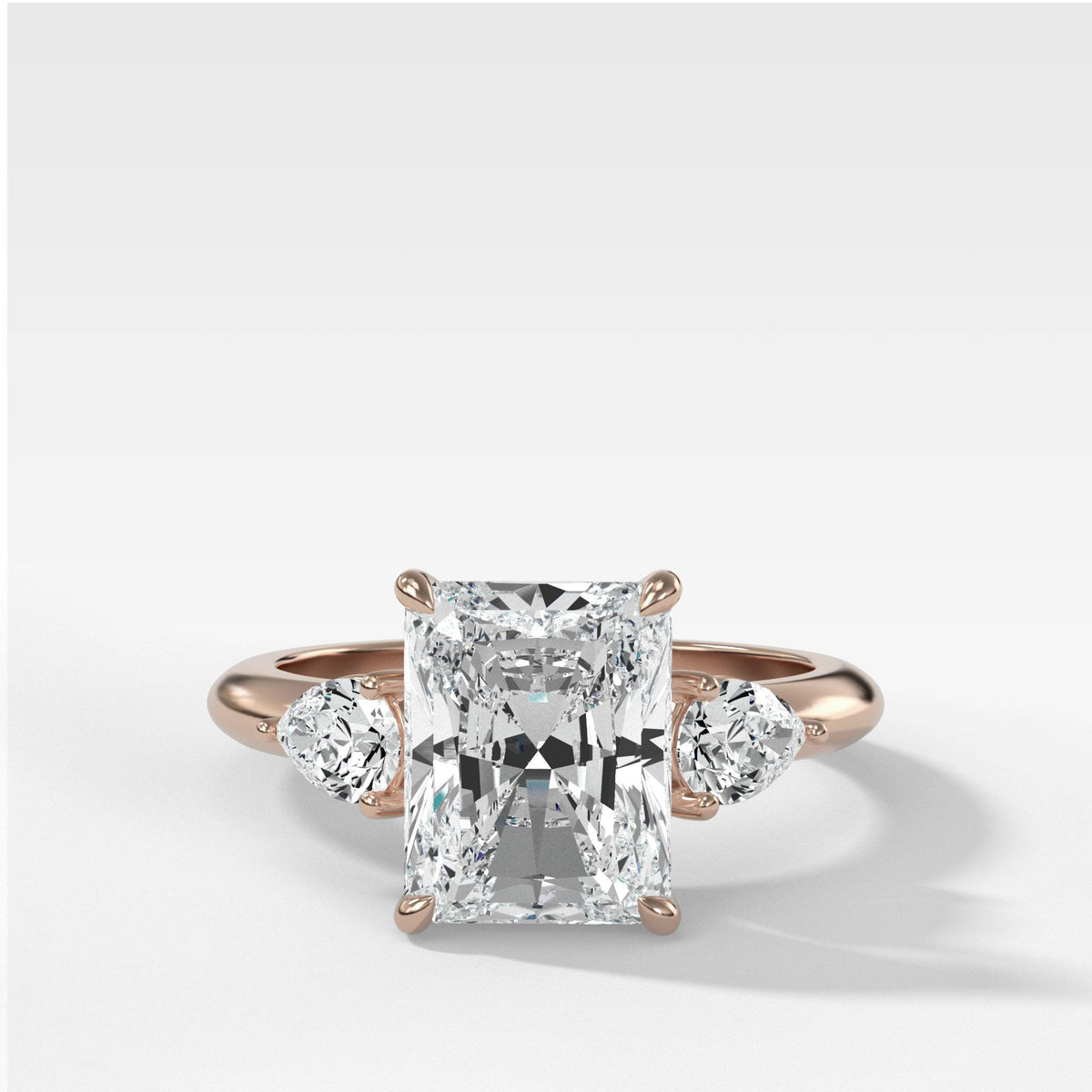 Three Stone Engagement Ring With Pear Side Stones and Radiant Cut by Good Stone in Rose Gold