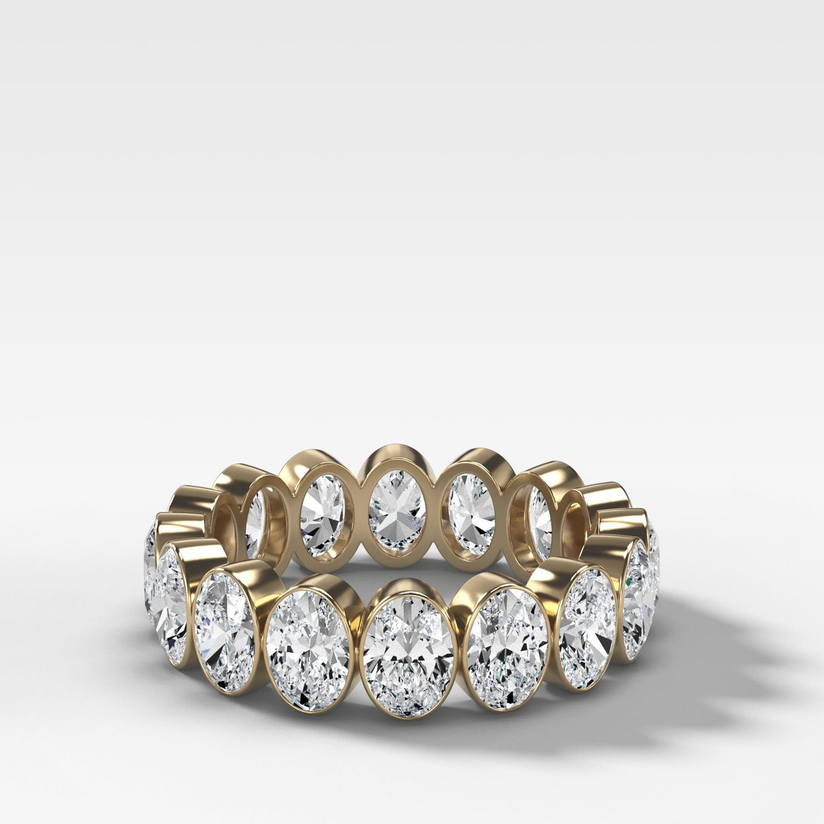 Bezel Set Eternity Band With Oval Cuts by Good Stone in Yellow Gold