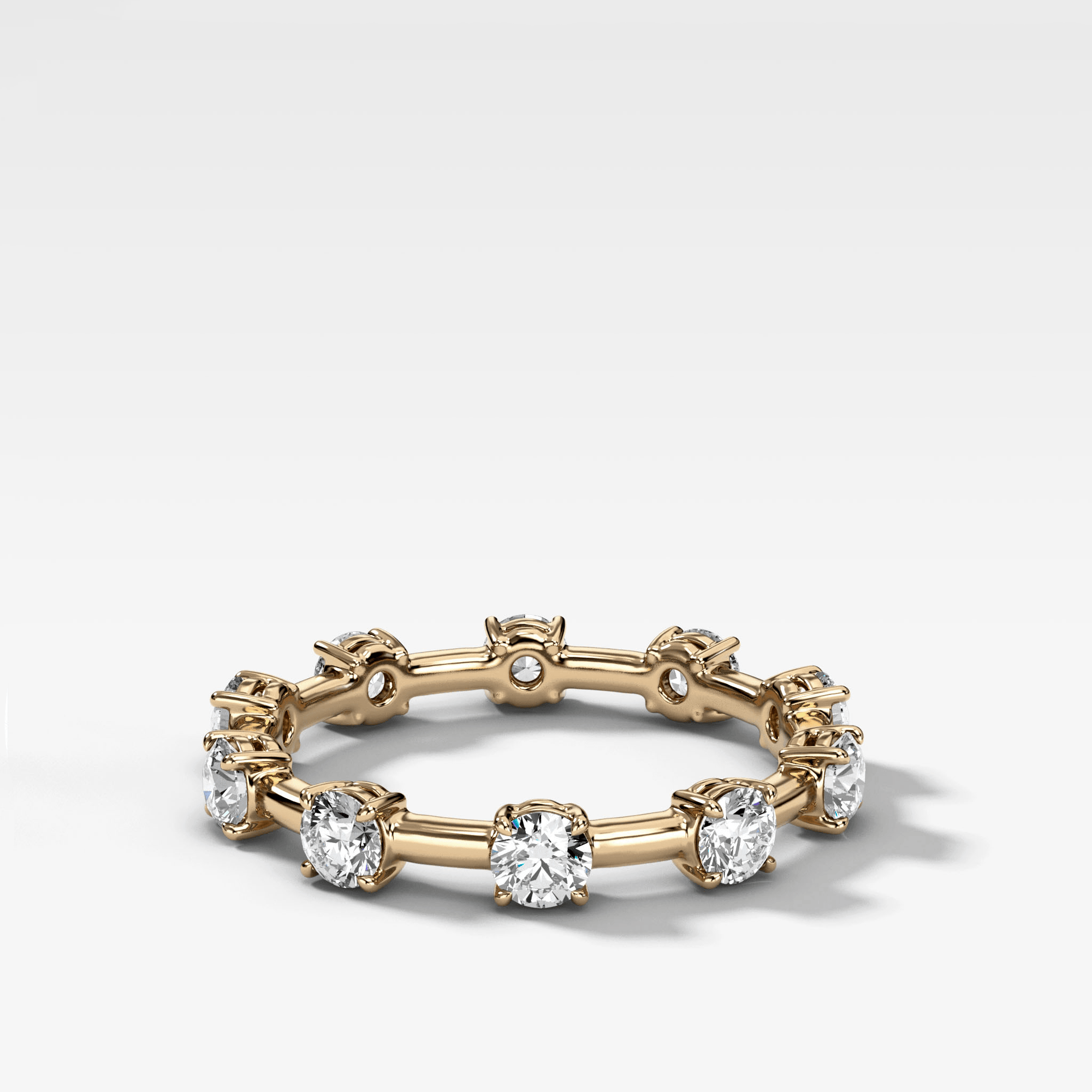 Claw Diamond Band: Jumbo Spaced Eternity Band by Good Stone in Yellow Gold