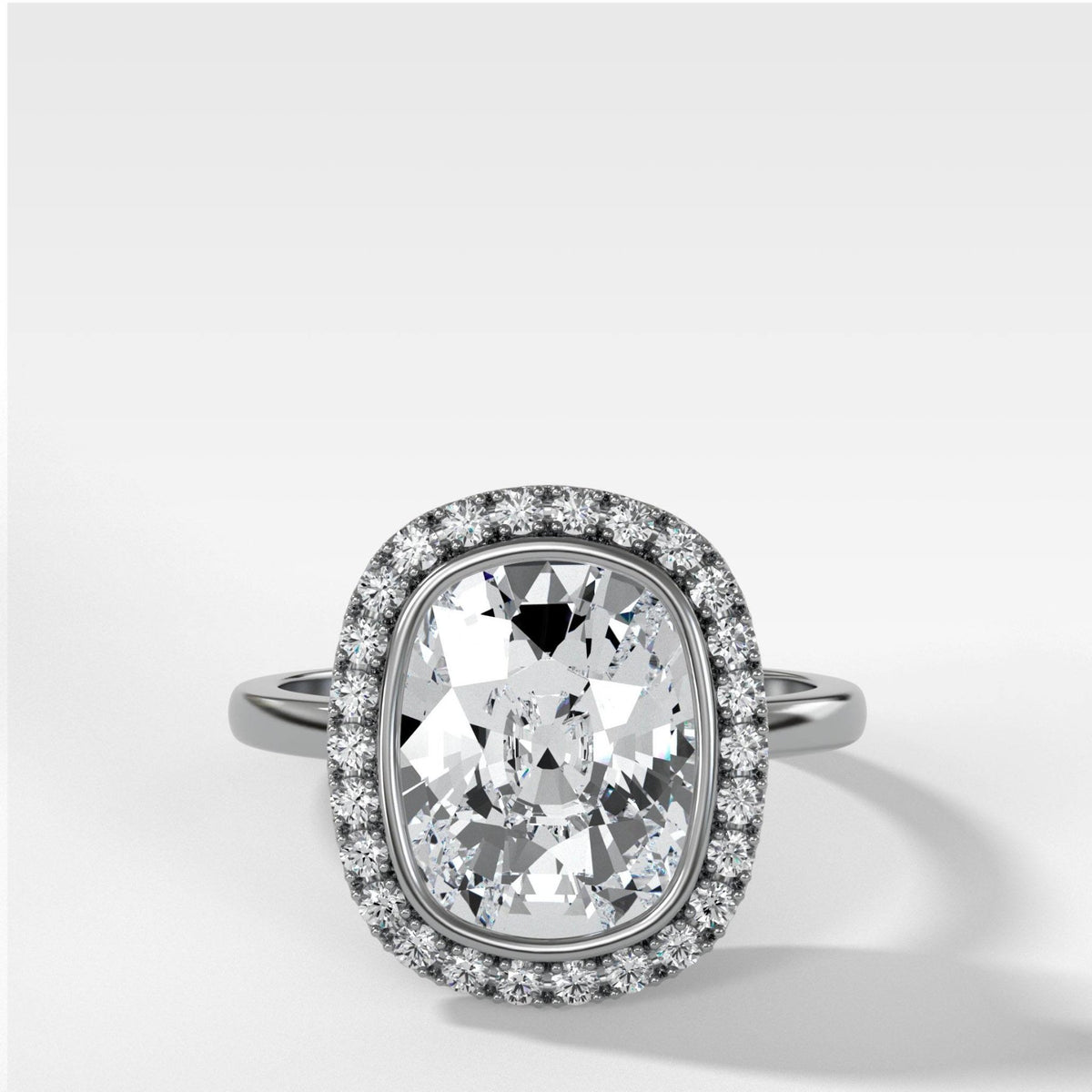 Bezel Set Halo Engagement Ring With Elongated Cushion Cut Diamond - GOODSTONE