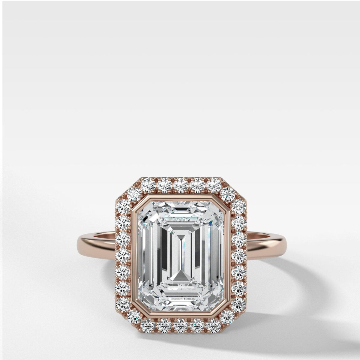 Bezel Set Halo Engagement Ring With Emerald Cut Diamond - GOODSTONE
